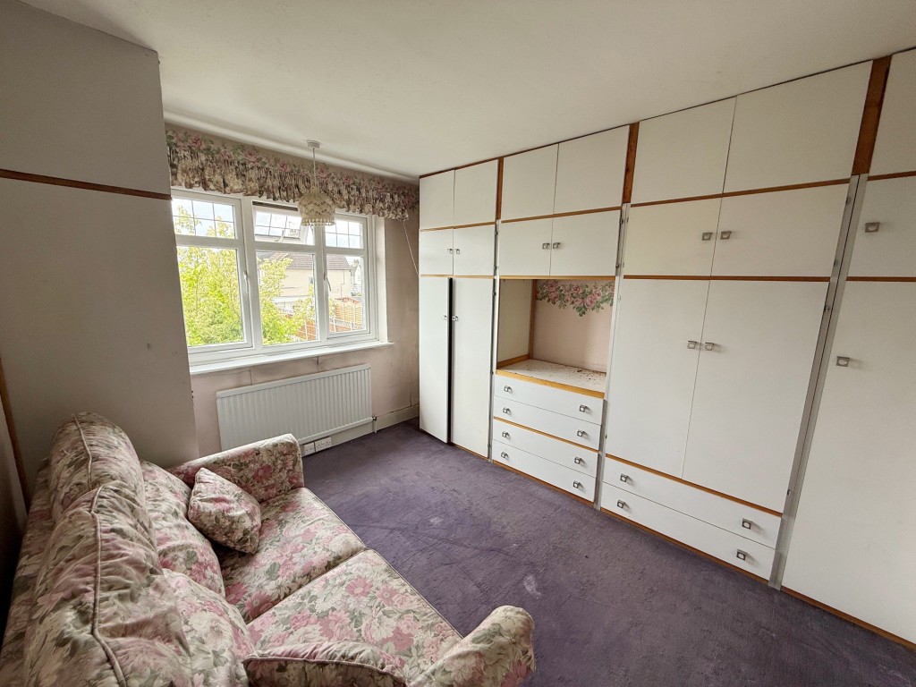 Lot: 90 - SEMI-DETACHED HOUSE FOR IMPROVEMENT - bedroom two with wardrobes and window to rear